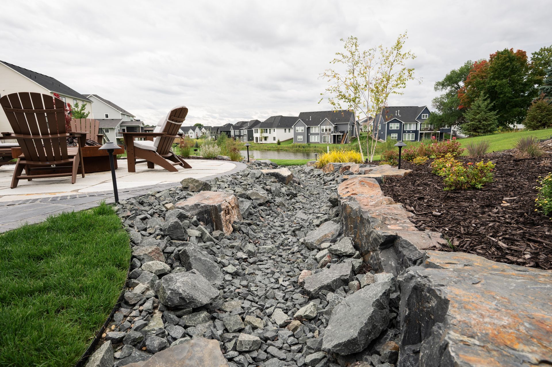 After photo of appropriate drainage installation in side yard in Edina. 