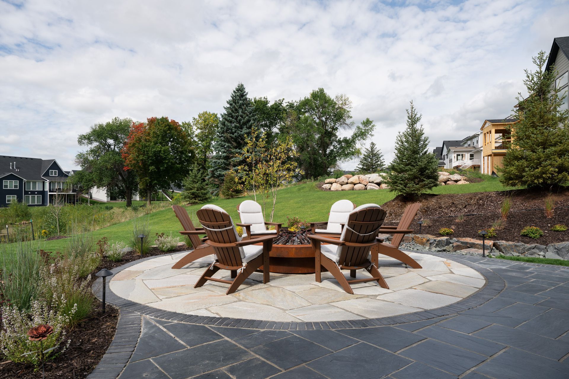 Flagstone patio with a custom fire pit in Minnesota. 