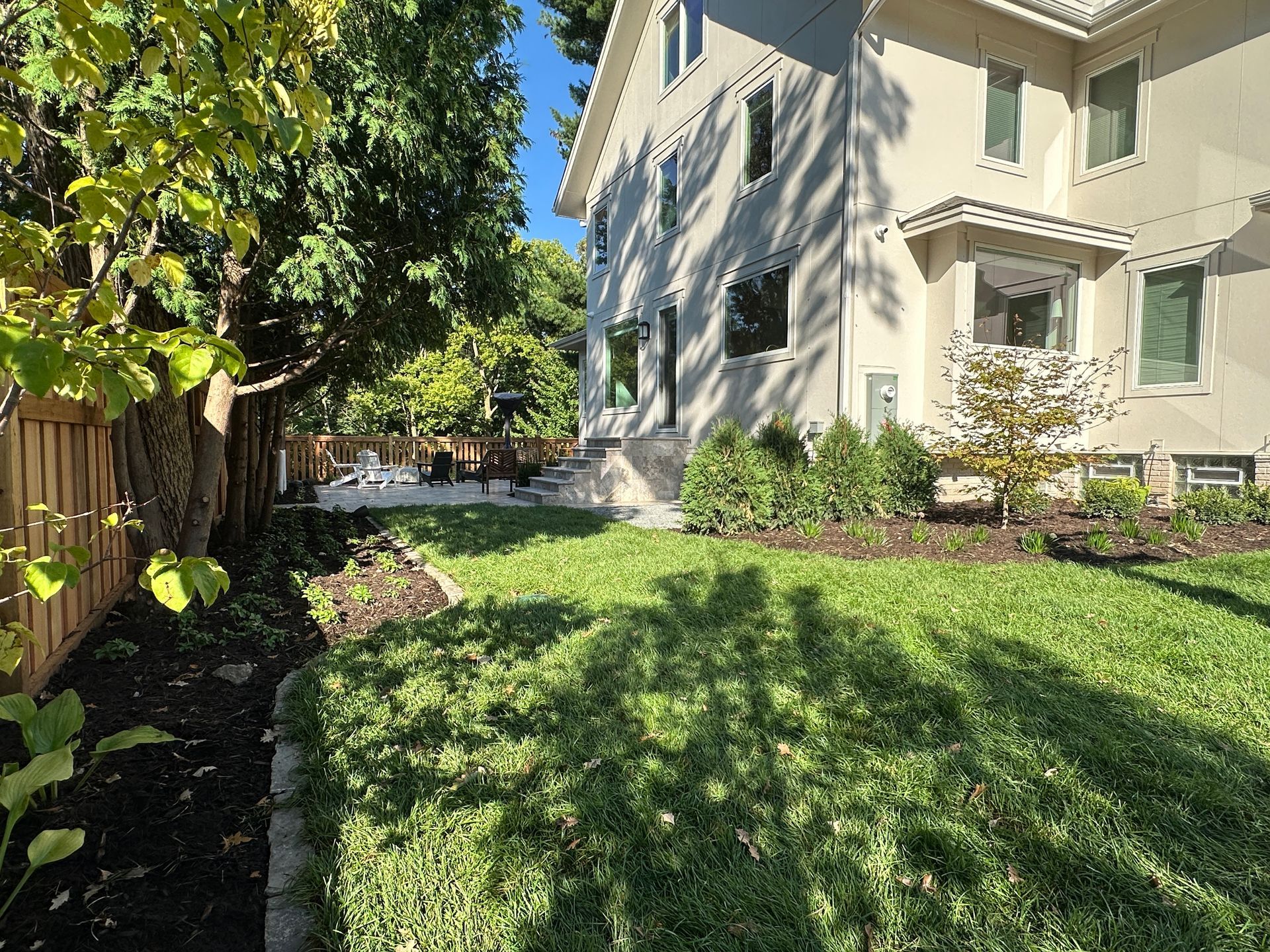 Small+backyard+landscaping+ideas+patio+with+custom+stone+stairs+stoop+landing+in+Minneapolis+MN+KG+Landscape