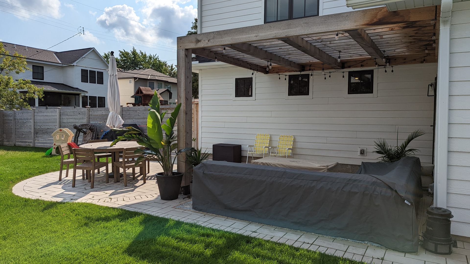 Before photo of very wet sideyard drainage problem in property line swale area in backyard in North Oaks, MN.