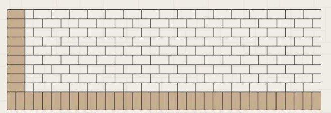 A white brick wall with a brown border