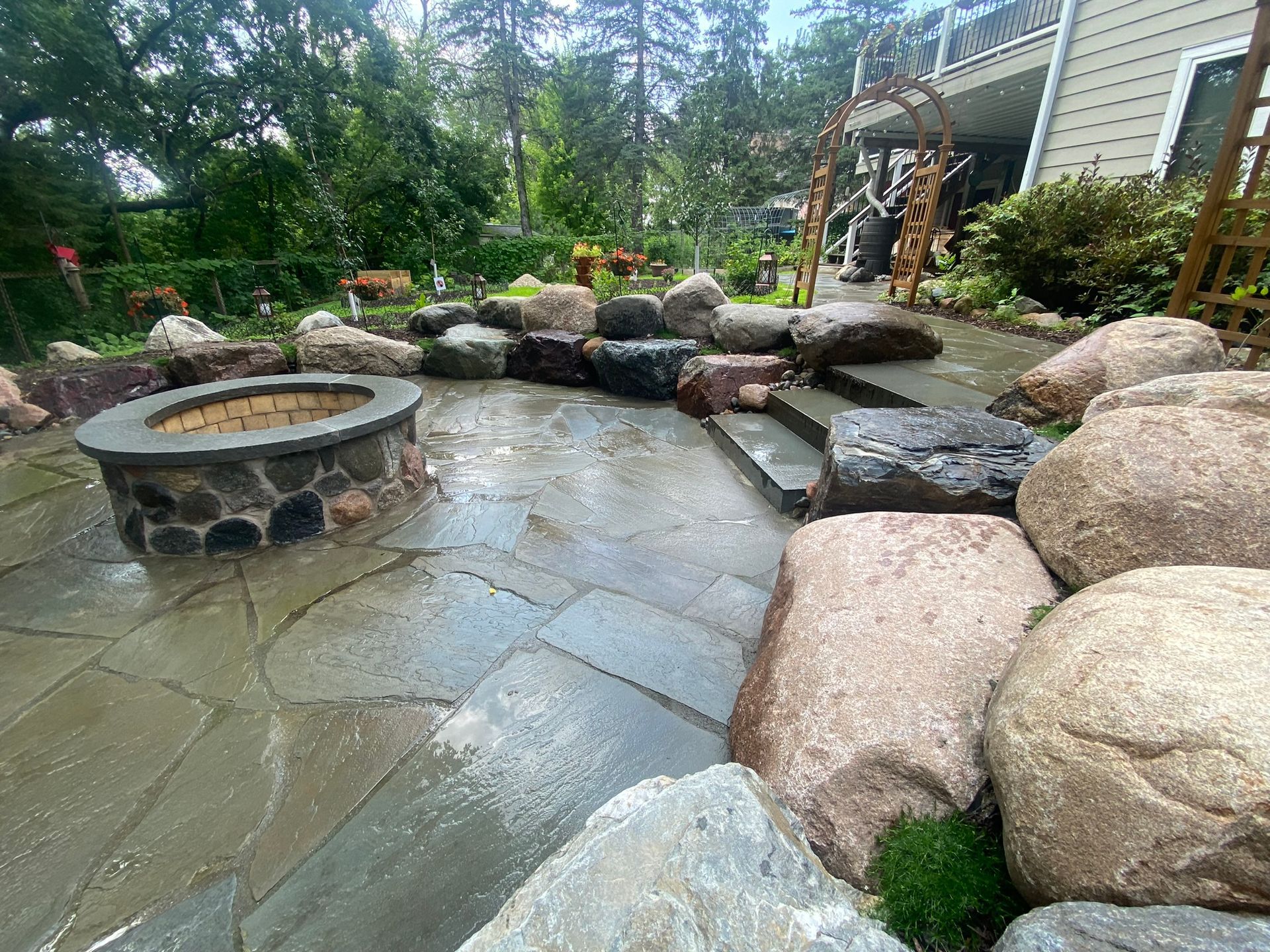 Sunken+Bluestone+patio+fire+pit+masonry+raised+fire+feature+with+capstone+boulder+sitting+wall+Plymouth+MN+KG+Landscape