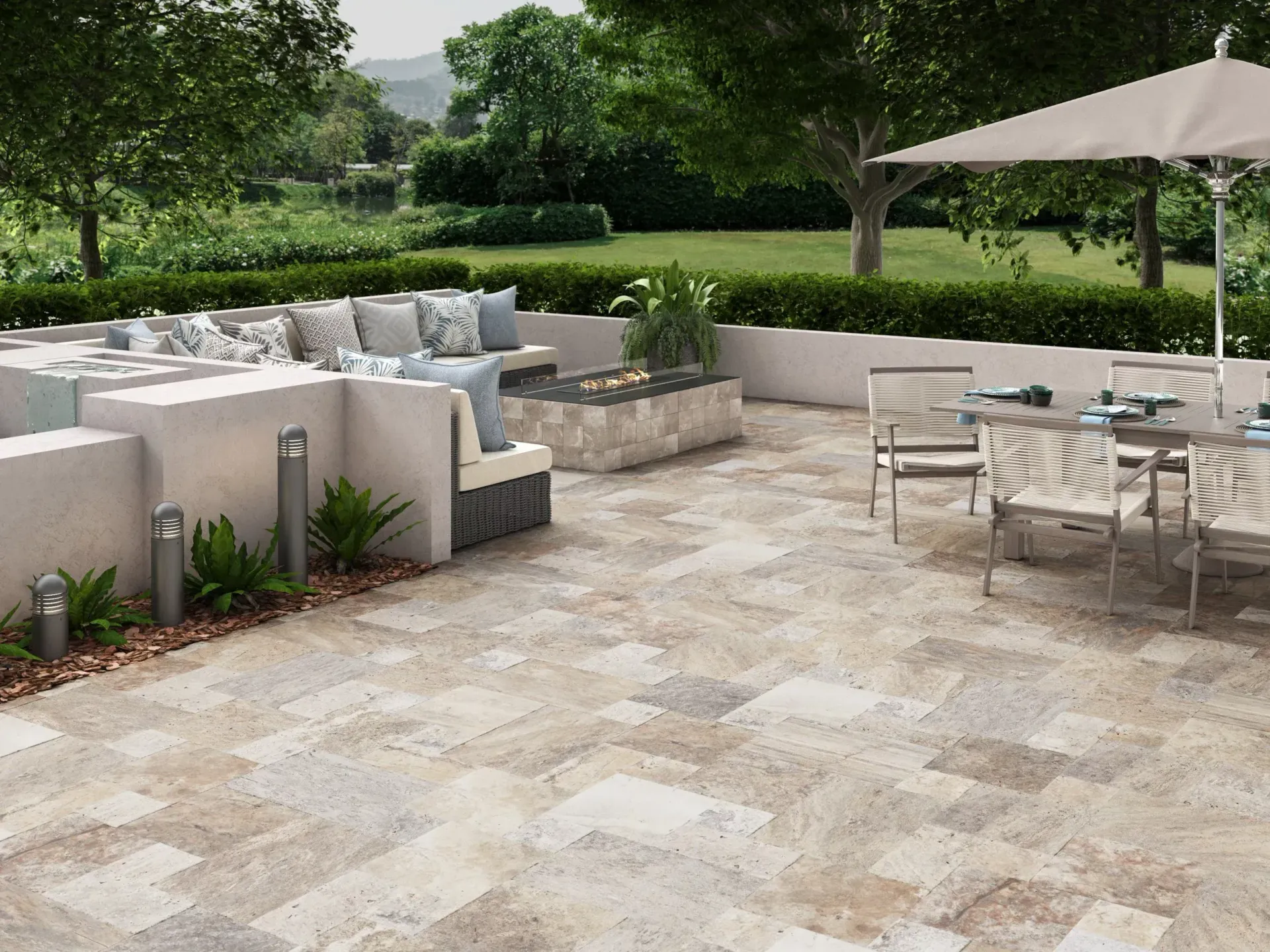 A patio with a table and chairs and an umbrella.