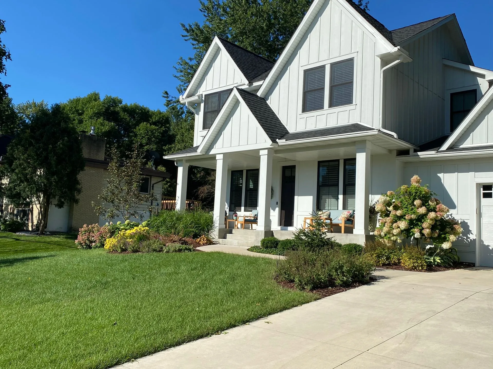 Front Yard Curb appeal Landscaping idea with colorful seasonal interest grasses evergreen  texture Edina MN Landscaping Design Contractor KG Landscape  