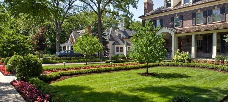 front yard landscaping with boxwood hedges and roses MN  