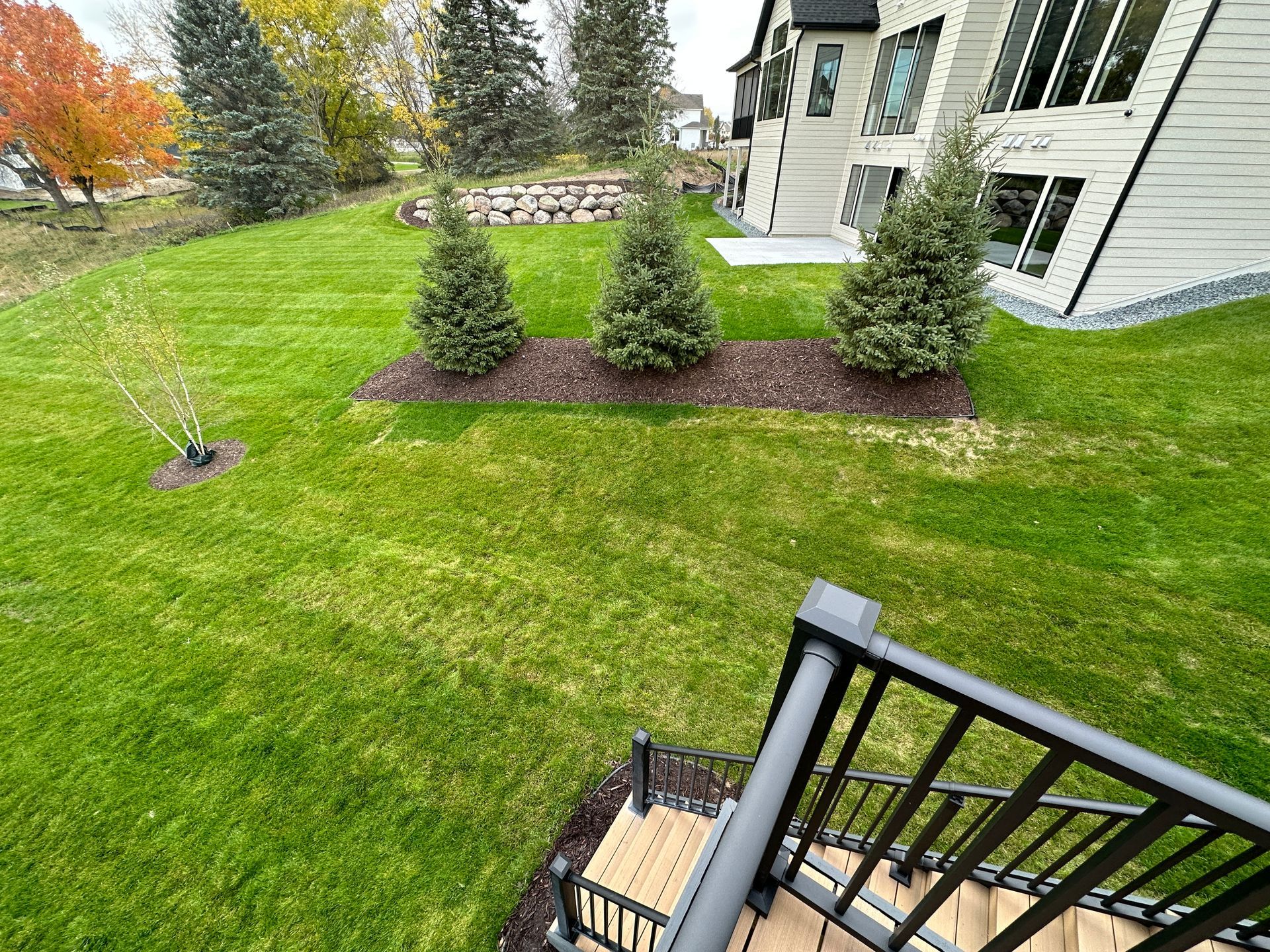 before hilly area of yard too sloped to use near deck steps landing