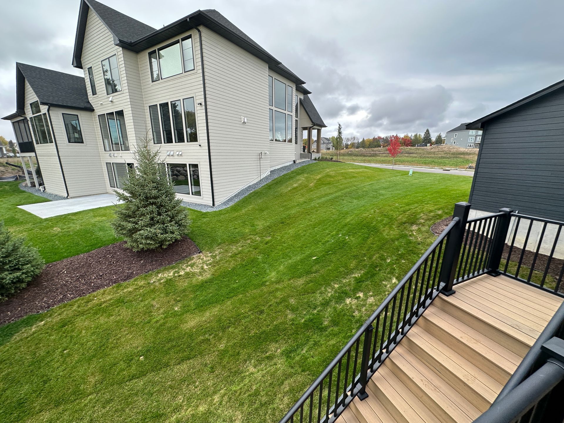 Before image of a hilly sideyard with no functional use. 