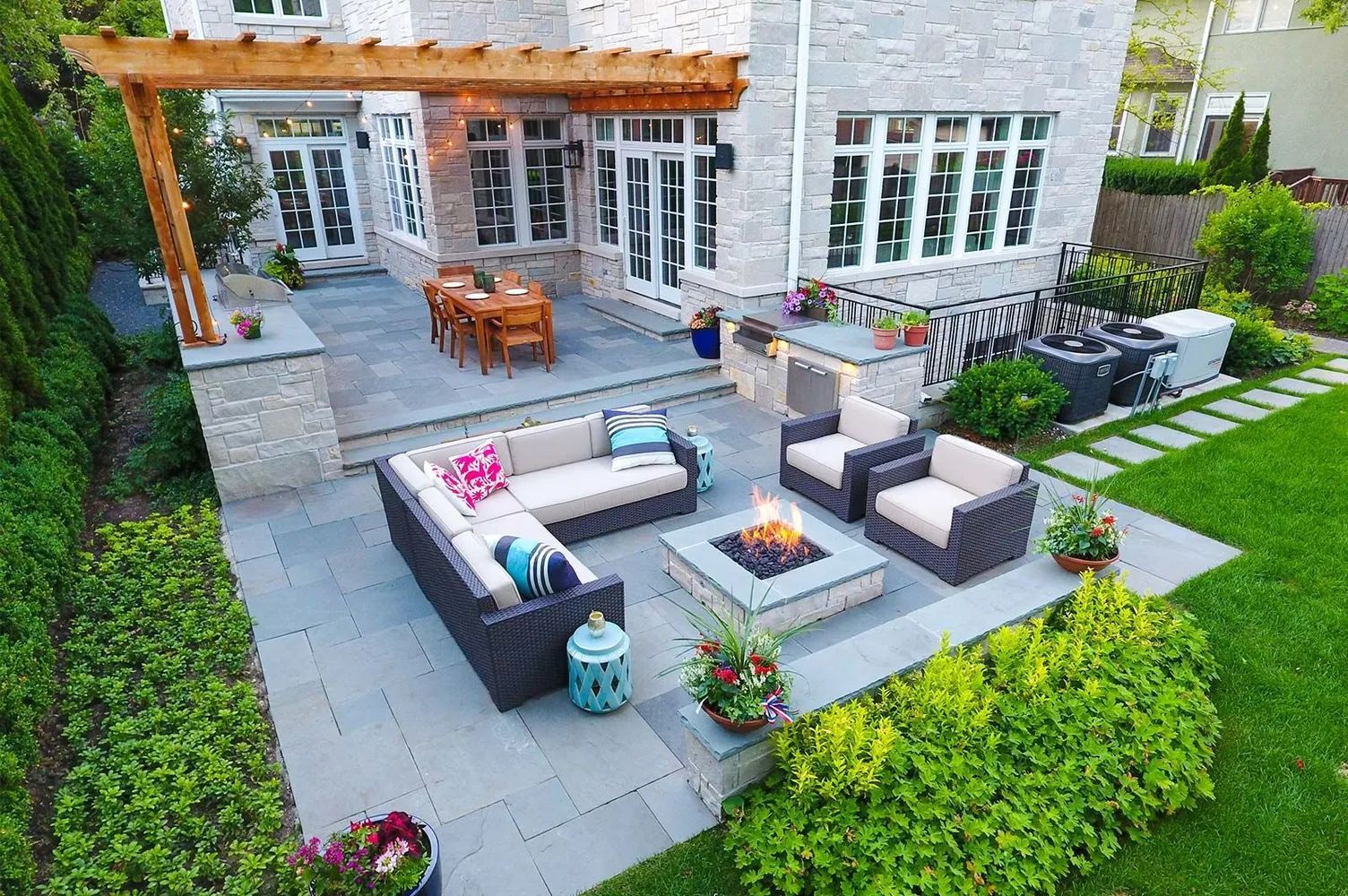 Bluestone backyard patio with pergola outdoor living space Minneapolis MN 