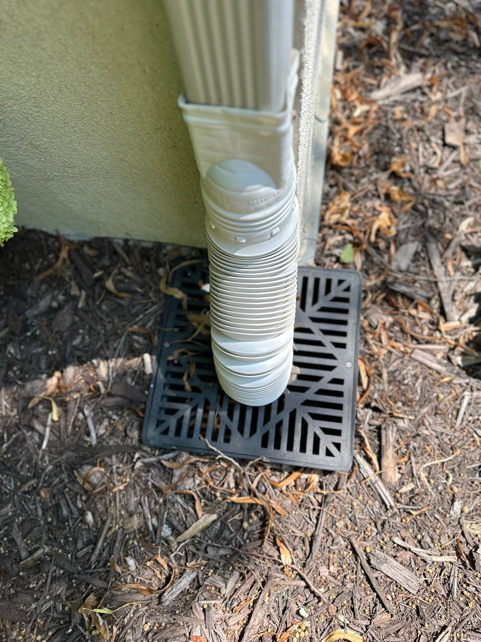 Down spout in yard build into patio 
