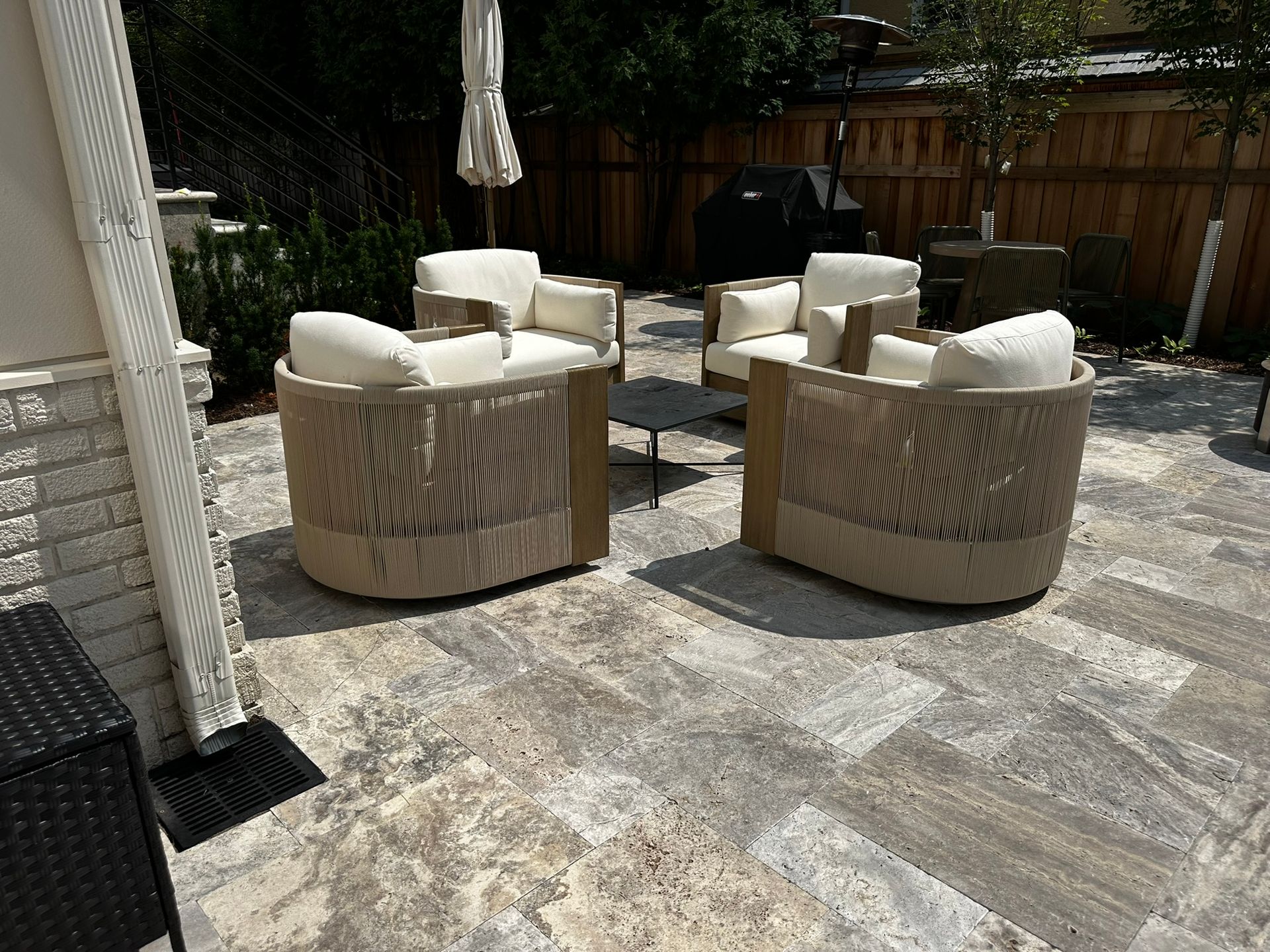 A catch basin with underground downspout drainage pipe we installed in / below a patio we built in Minneapolis 