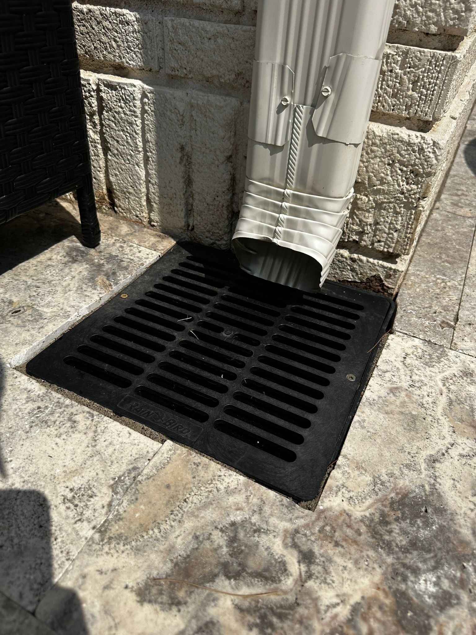 catch basin below down spout connected to underground drain pipe in MN 