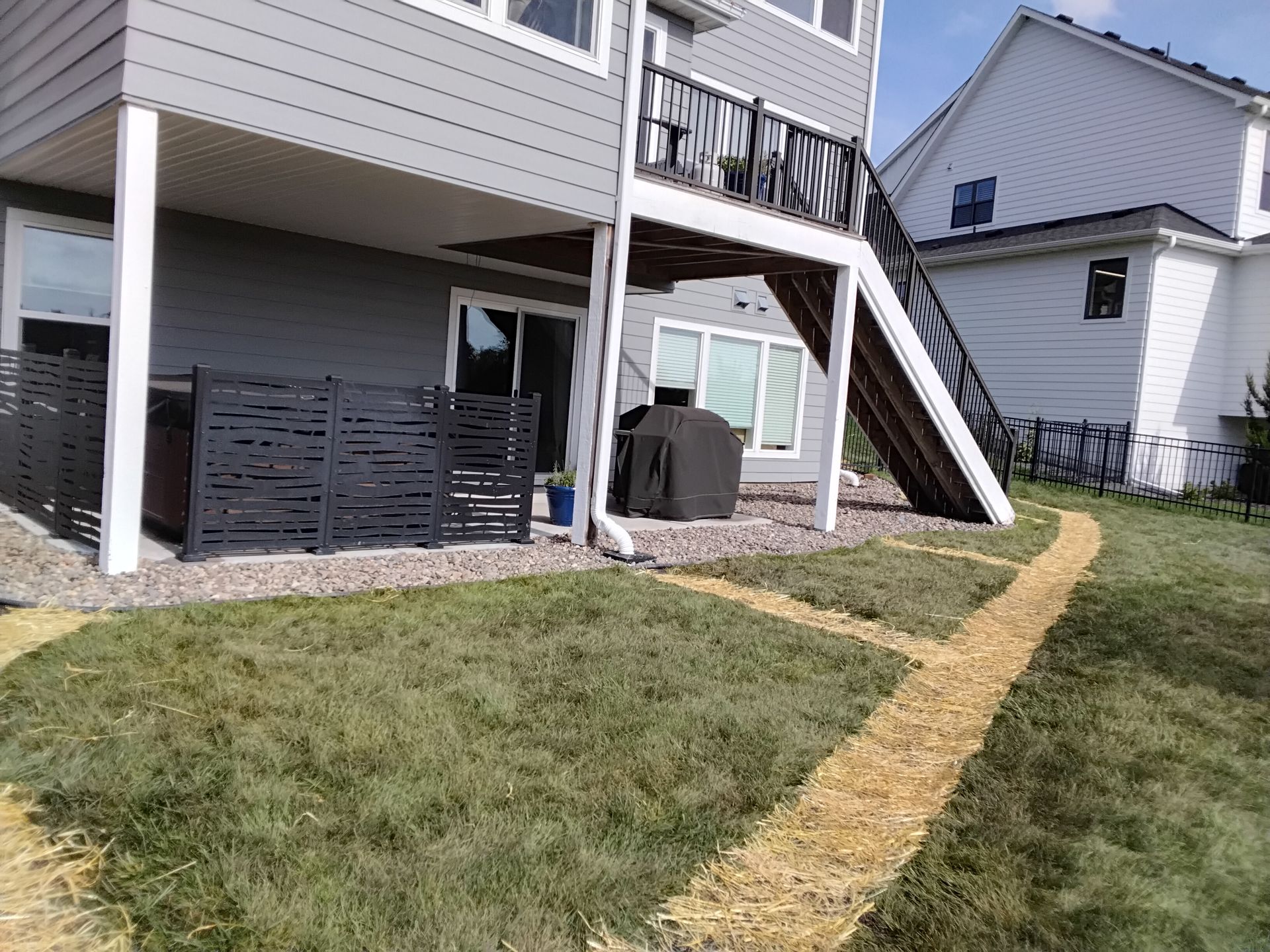 After picture of lawn repaired after trenching and yard drainage pipe was installed in Plymouth MN 