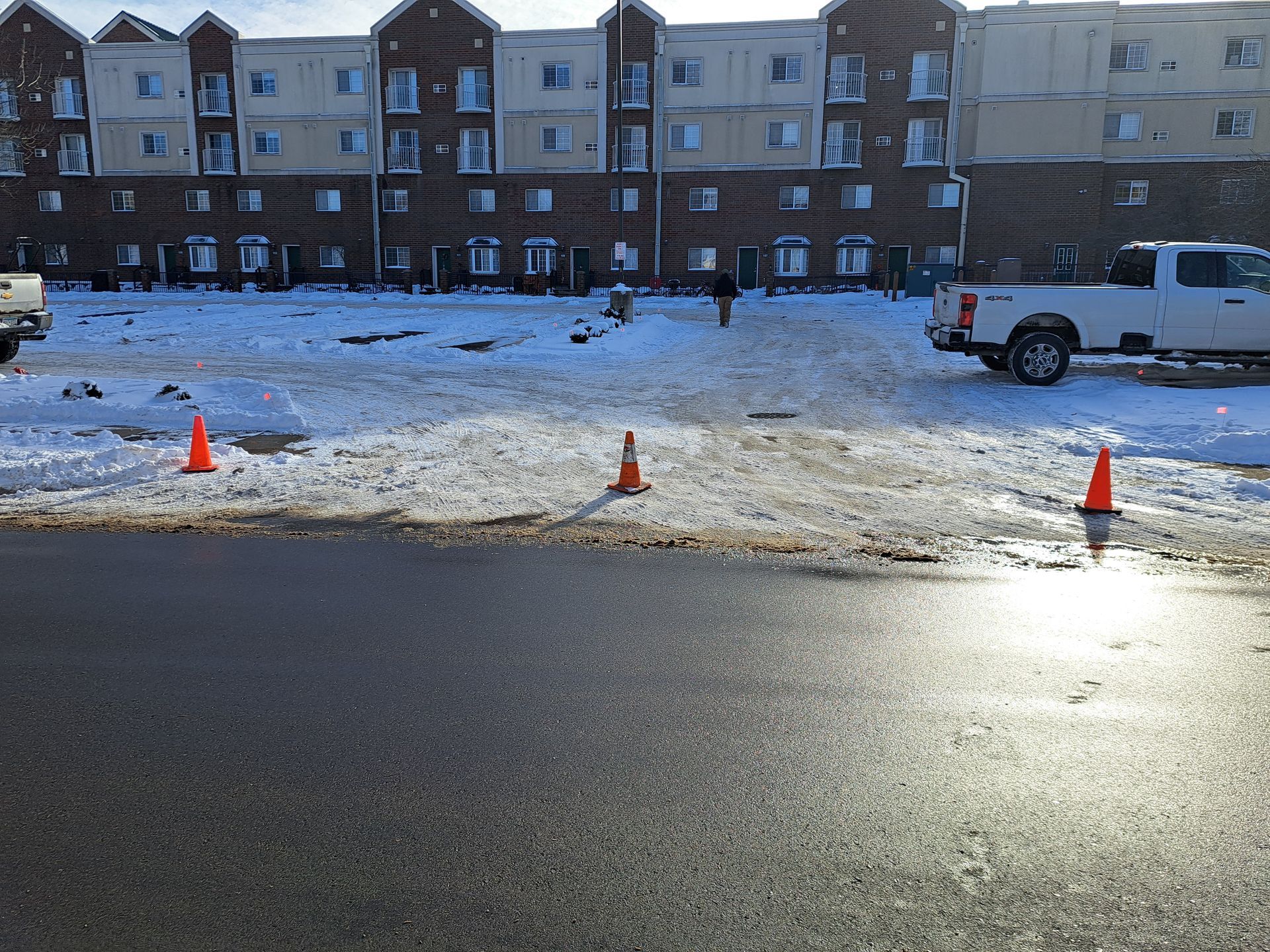 Coned off parking lot for full snow plowing in Minnesota