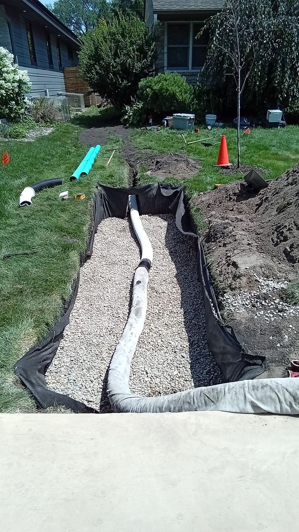 Dry well drainage system being installed in a front yard in Minneapolis MN