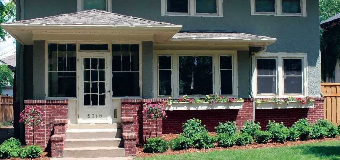 Front yard Clean simple low maintenance landscaping Great design Minneapolis MN KGLandscape.com boxwoods roses roses tree window boxes with flowers 