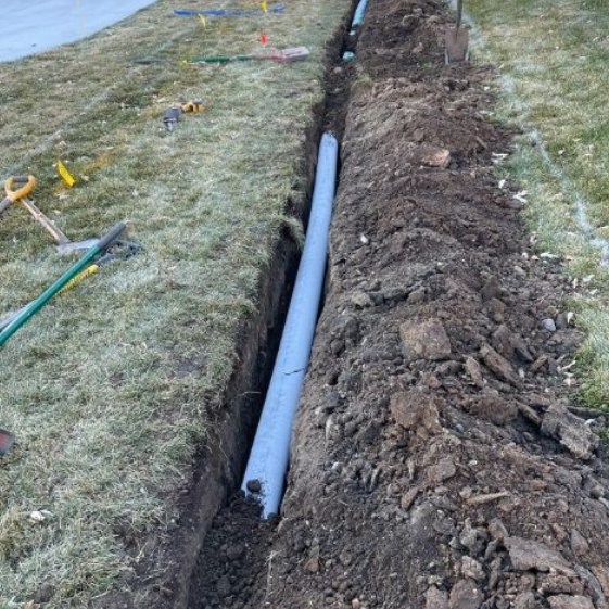 Drain tile being installed