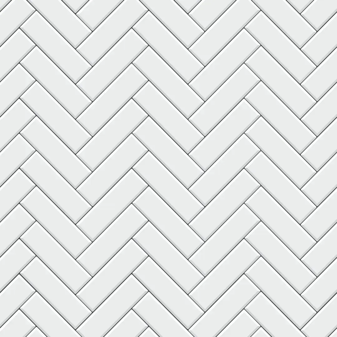 A seamless pattern of white subway tiles in a herringbone pattern.