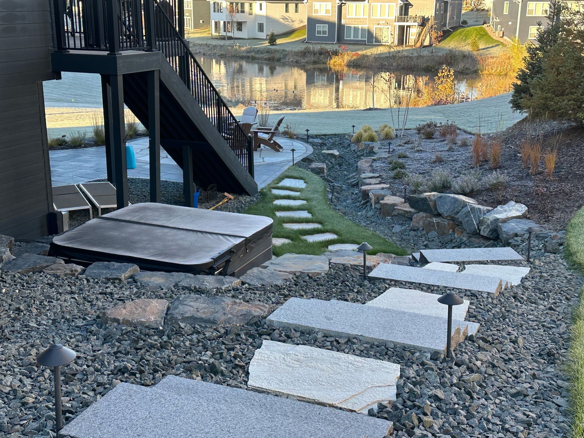 hillside landscaping stone steps pathway creek bed and hot tub