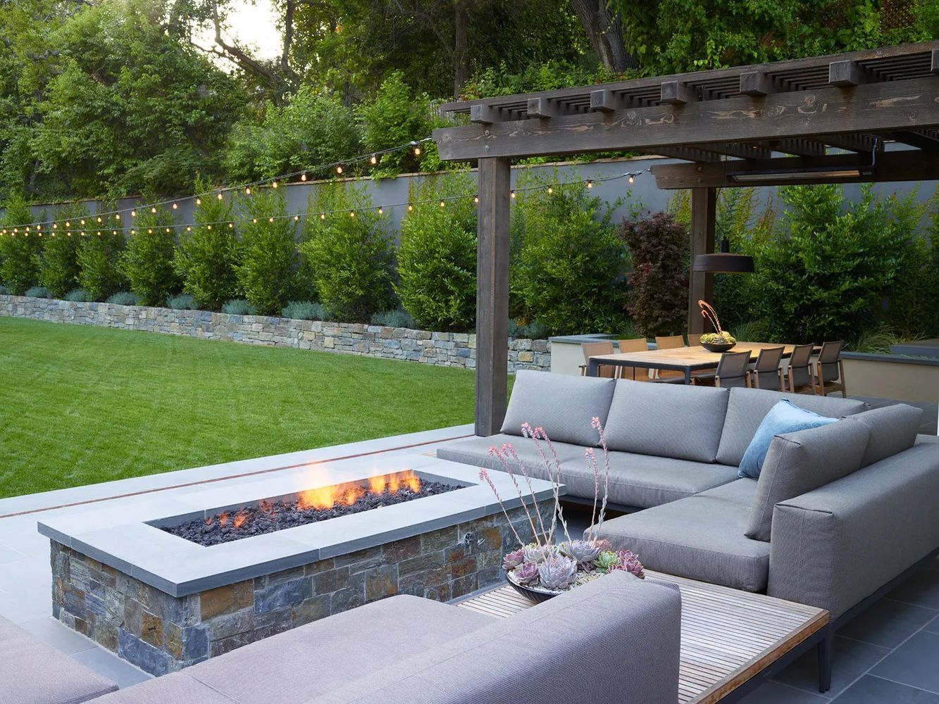 Modern bluestone patio with pergola backyard fire feature Minneapolis MN   