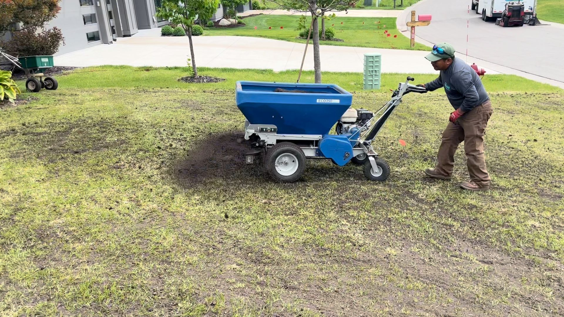 applying organic topdressing to lawn in Minnesota.