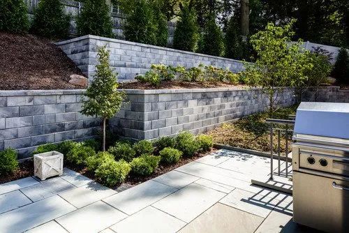nice large retaining wall built with gray blocks modern style in MN 