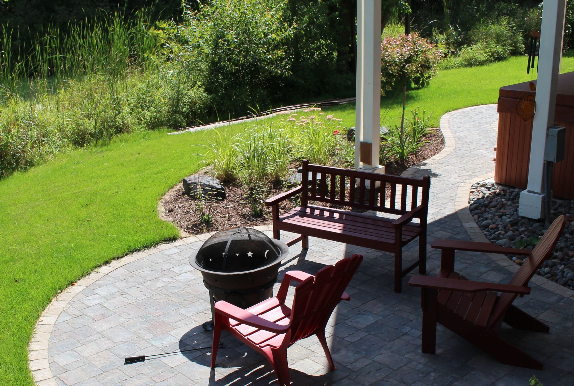 small+paver+patio+with+walkway+gardens+near+wetland+hot+tub+pad+below+deck+Blaine+MN+KG+Landscape