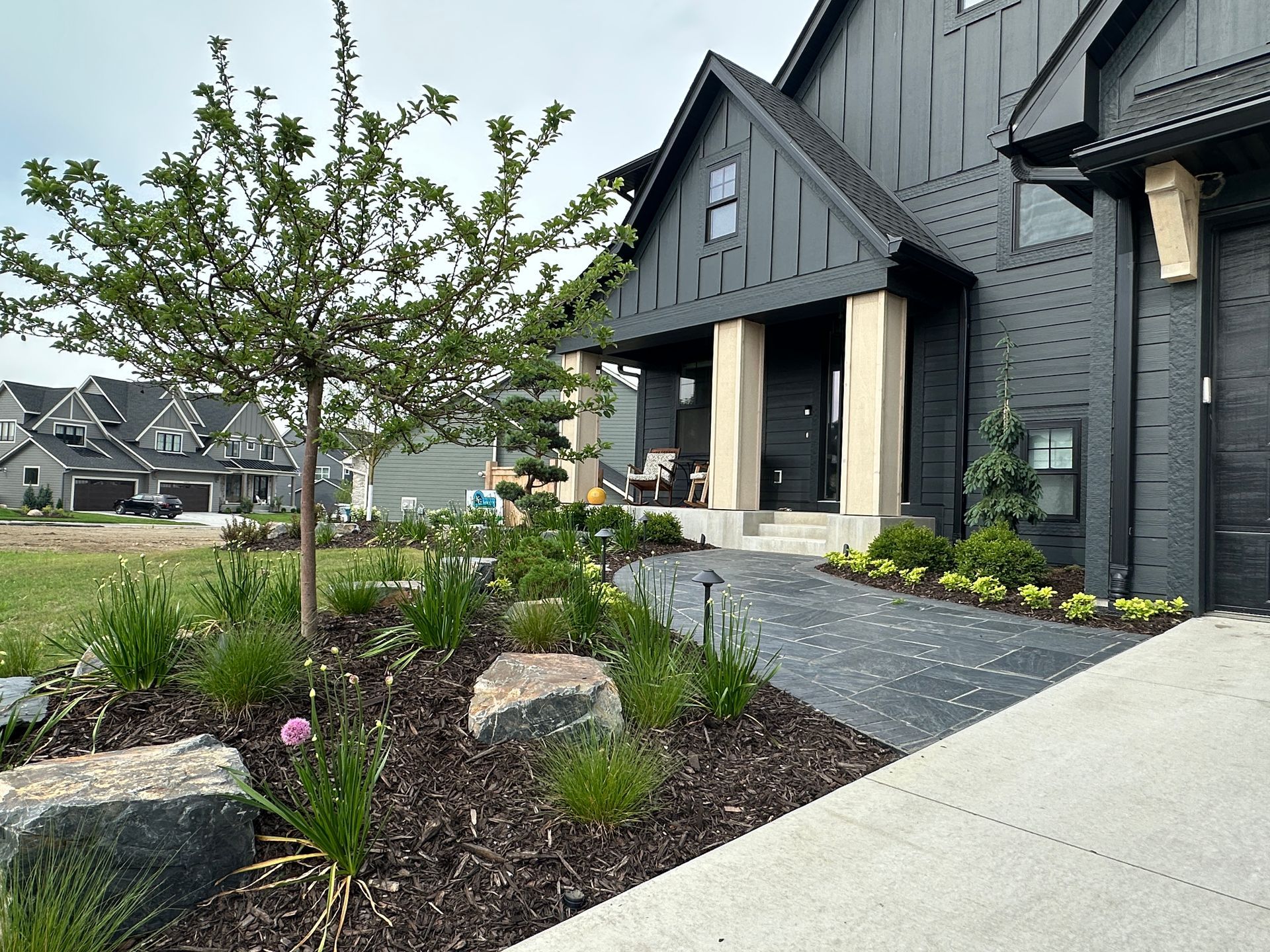 Modern home with stone walkway. 