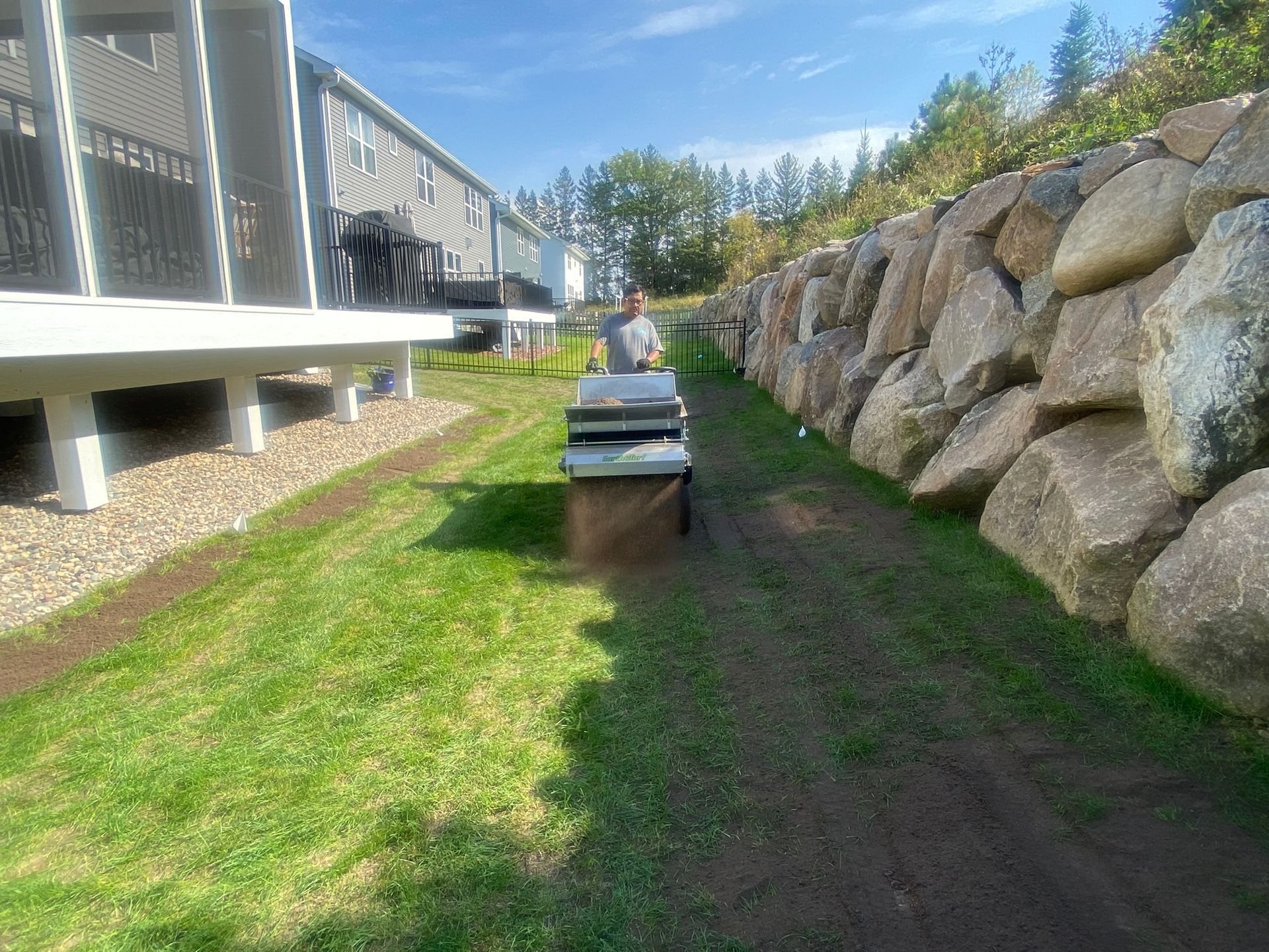 During: foreman applying topdressing soil mix 