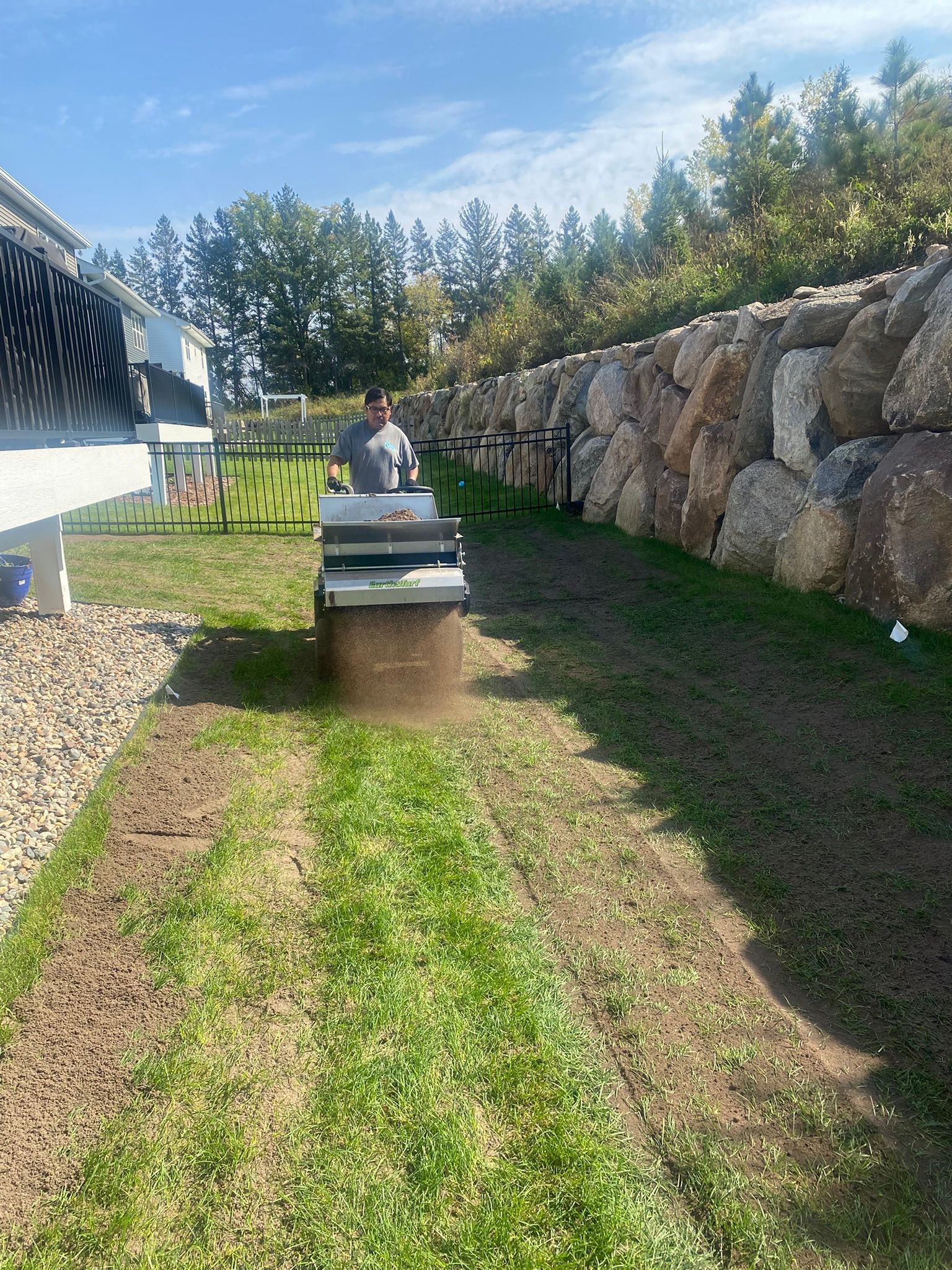 crew installing topdressing soil 