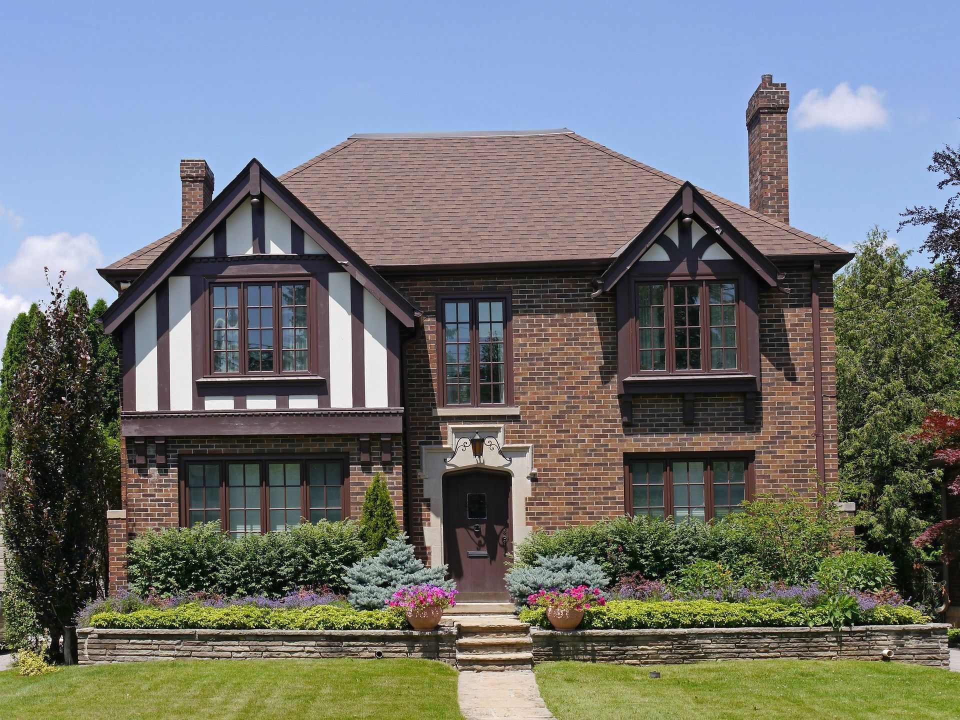 A large brick house with a brown roof