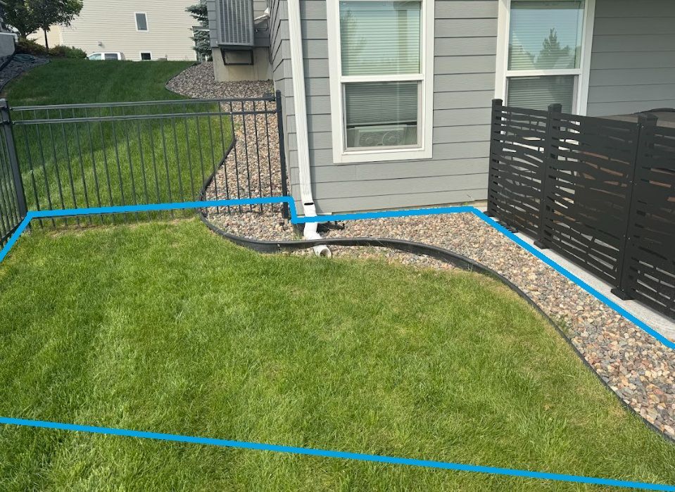 wet side yard where hill meets flat back yard for walk out basement lot in plymouth MN