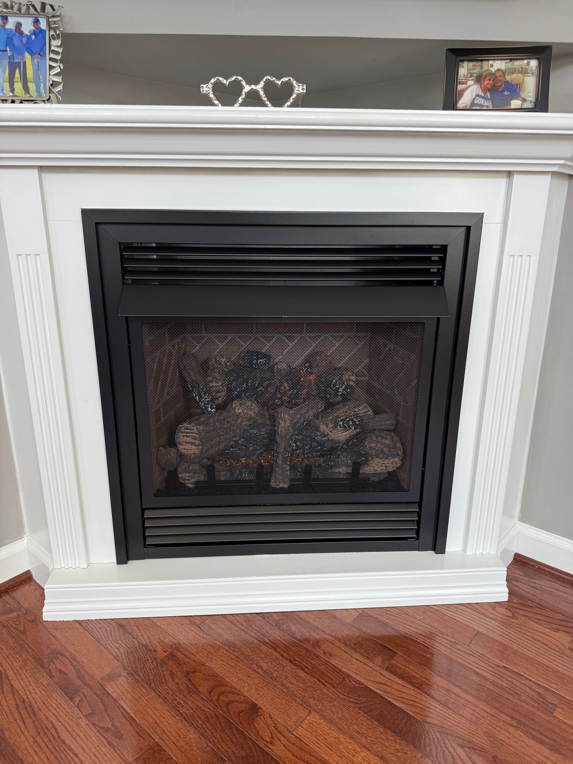 Fireplace With A Black Interior White Trim And Wooden Floor — Falls Church, VA — Nova Gas Fireplace With A Black Interior White Trim And Wooden Floor — Falls Church, VA — Nova Gas
