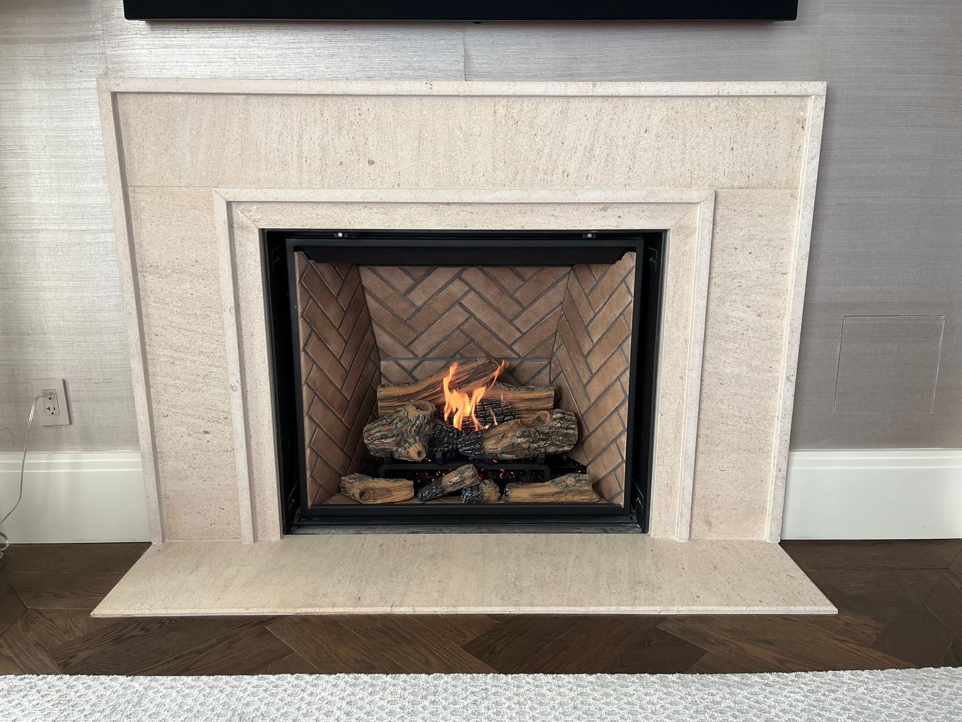 Fireplace With Beige Stone Surround — Falls Church, VA — Nova Gas Fireplace With Beige Stone Surround — Falls Church, VA — Nova Gas