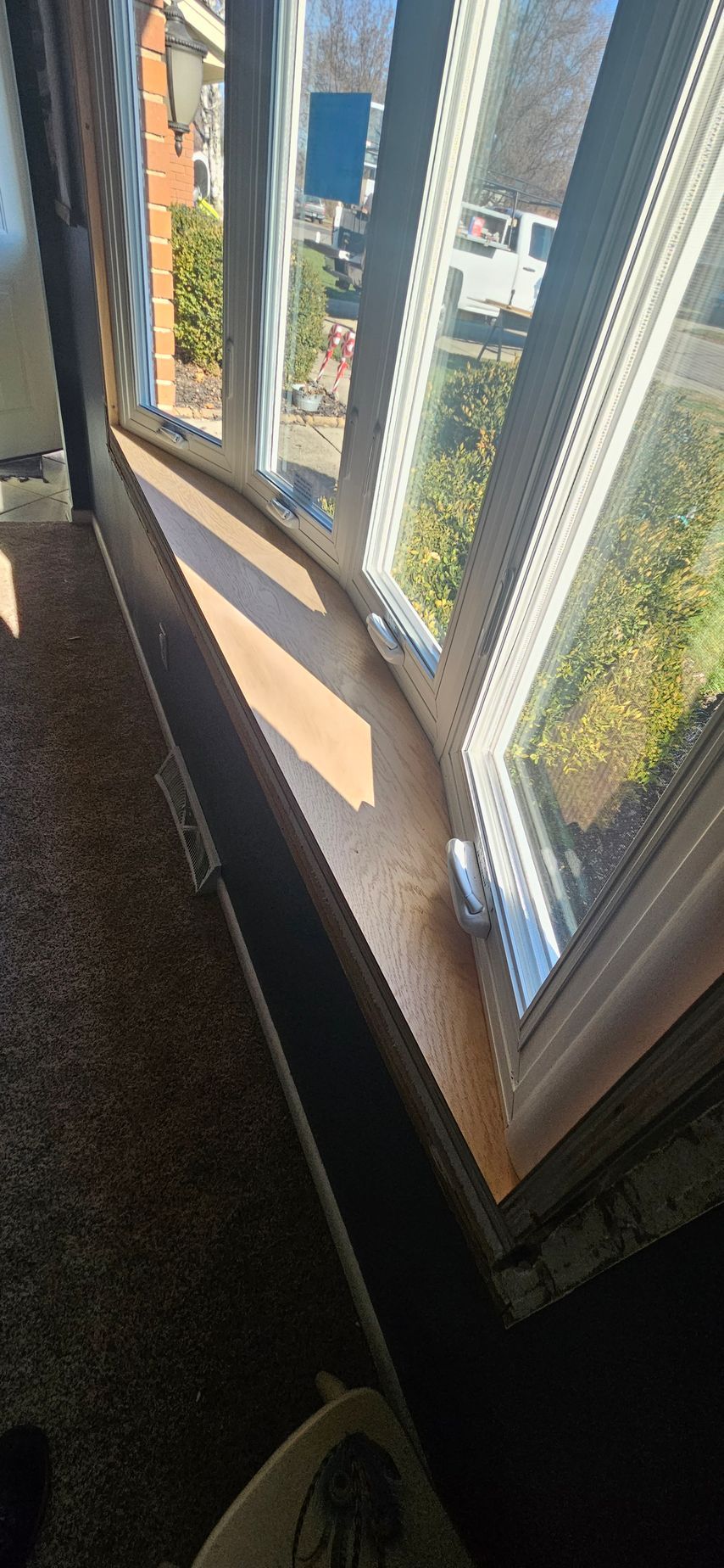 The sun is shining through the windows of a house.