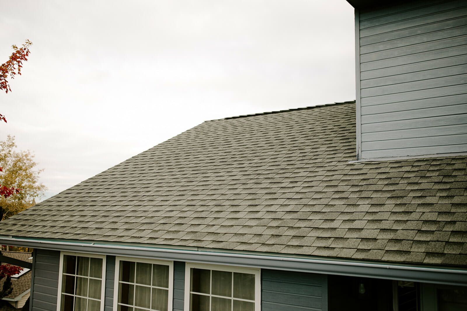A house with a roof that has shingles on it