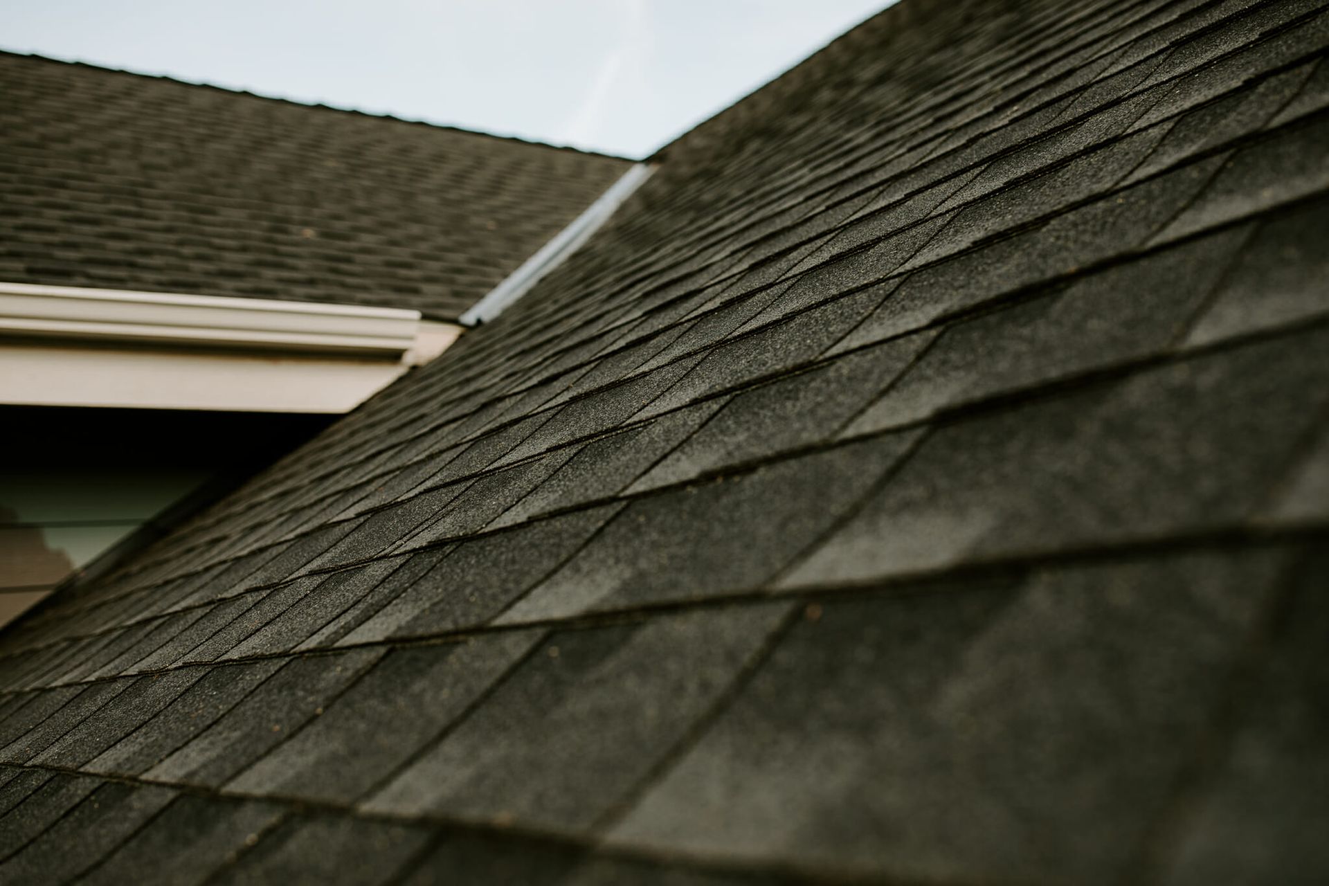 A close up of a roof with shingles on it.