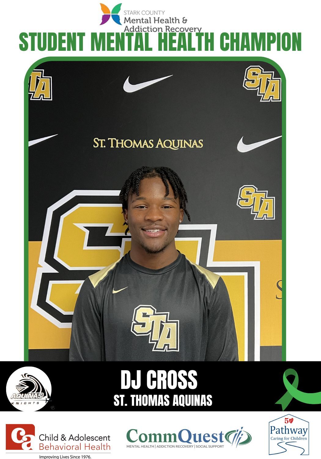 Student mental health champion DJ Cross from St. Thomas Aquinas. He is smiling in front of a school backdrop.