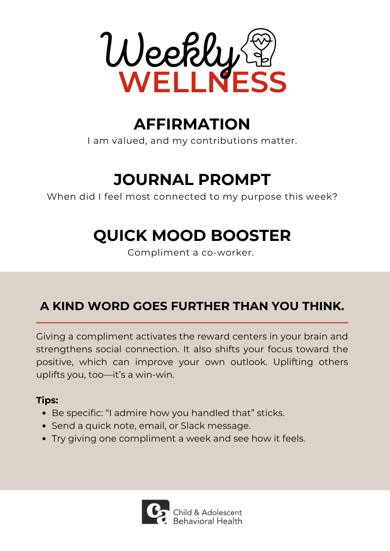 Woman in teal shirt, smiling with eyes closed, holding a red heart against a pink background.