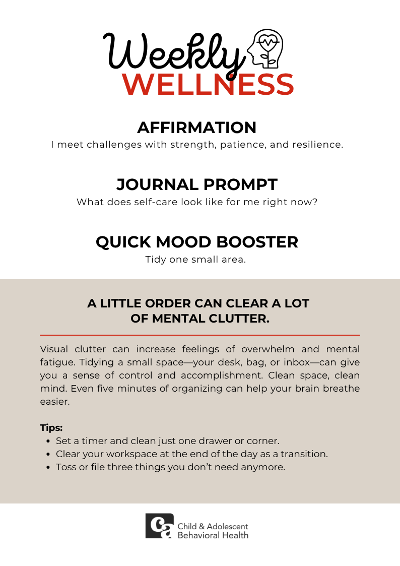 Woman in teal shirt, smiling with eyes closed, holding a red heart against a pink background.