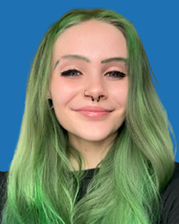 Young woman with purple hair smiles, nose and eyebrow piercings, blue background.