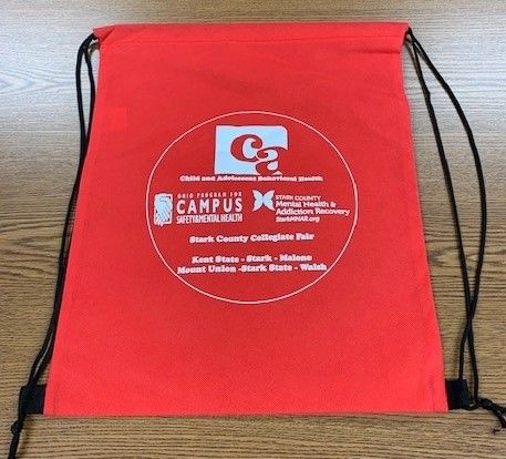 Red drawstring bag with a white logo.