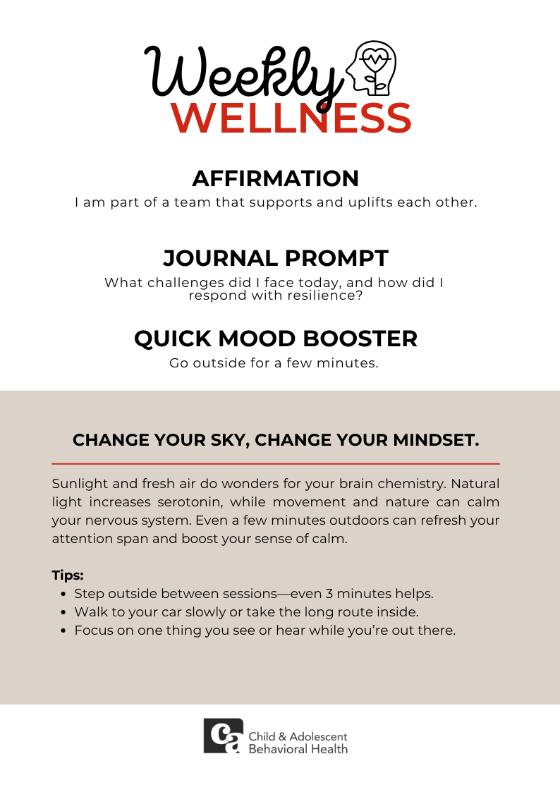 Woman in teal shirt, smiling with eyes closed, holding a red heart against a pink background.