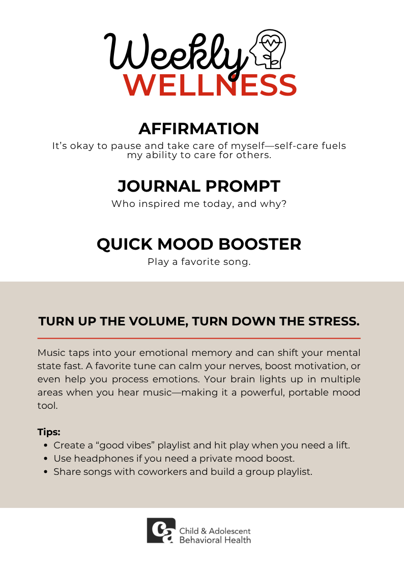 Woman in teal shirt, smiling with eyes closed, holding a red heart against a pink background.