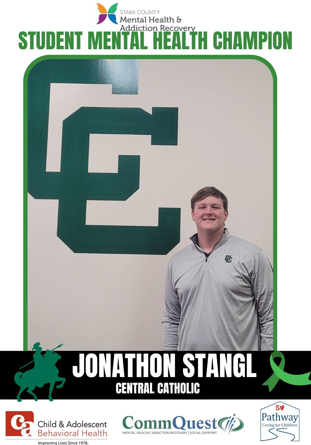 Student, Jonathon Stangl, stands in front of a Central Catholic logo. He is a student mental health champion.