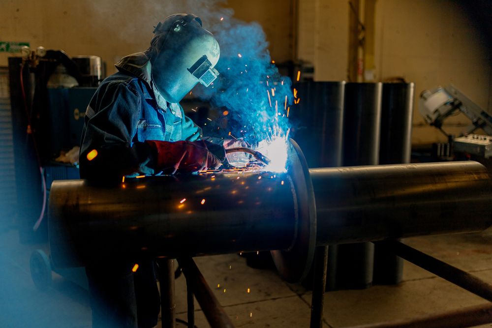 Industrial Worker Welding on the Pipe — Woolgoolga, NSW — RT Welding Services Pty Ltd