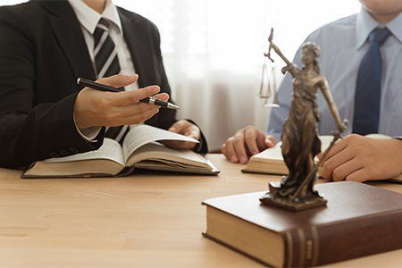 Lady Justice on Law Book With Lawyer — Woodsfield, OH — Smith Law Firm