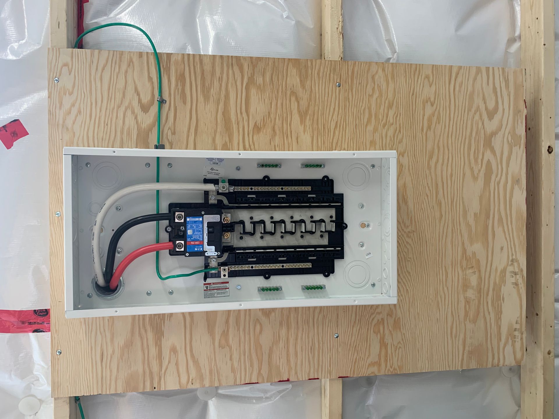 A white box with electrical wires coming out of it