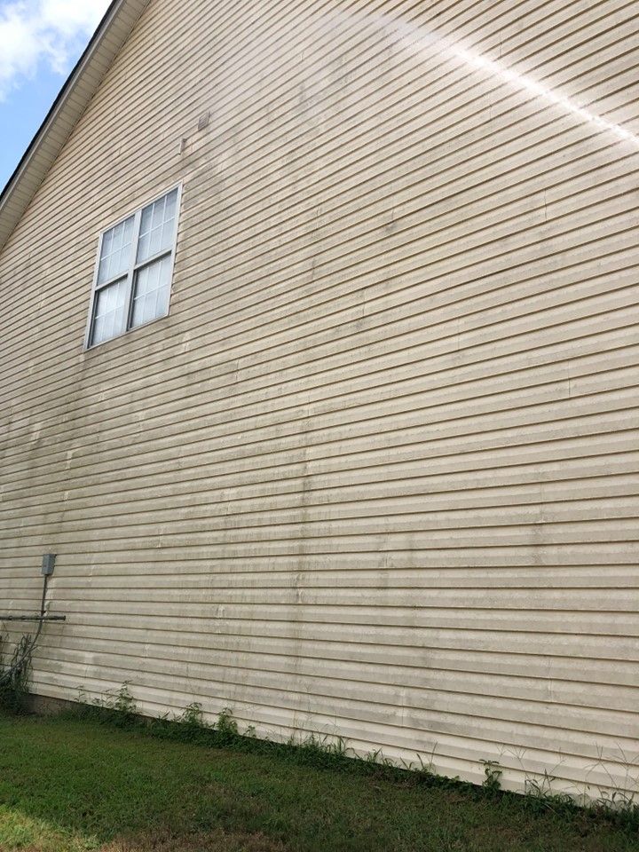 A house with a lot of stains on the side of it.