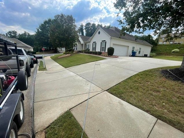 A jeep is parked on the side of the road in front of a house.