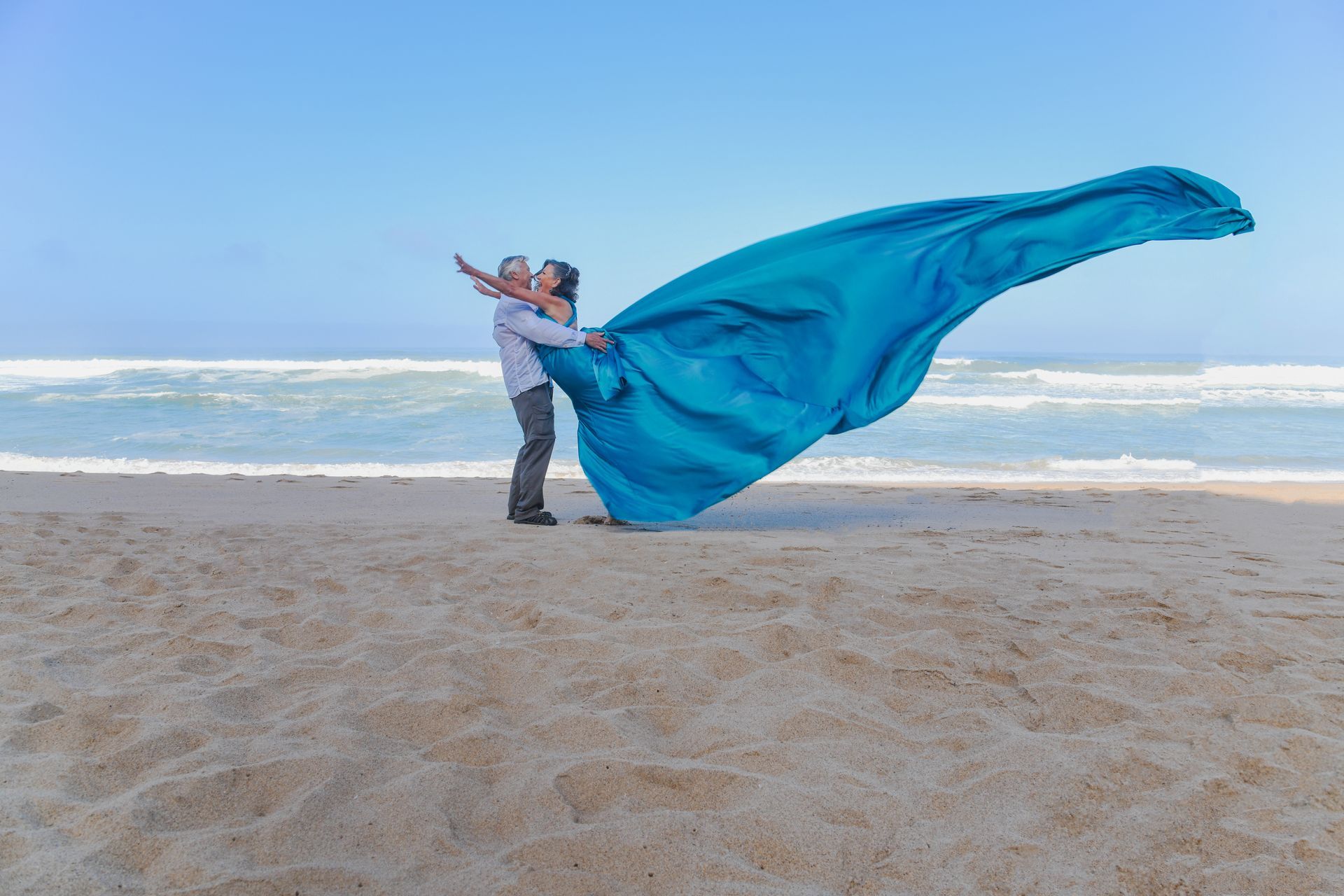 Couple Flying Dress Beach